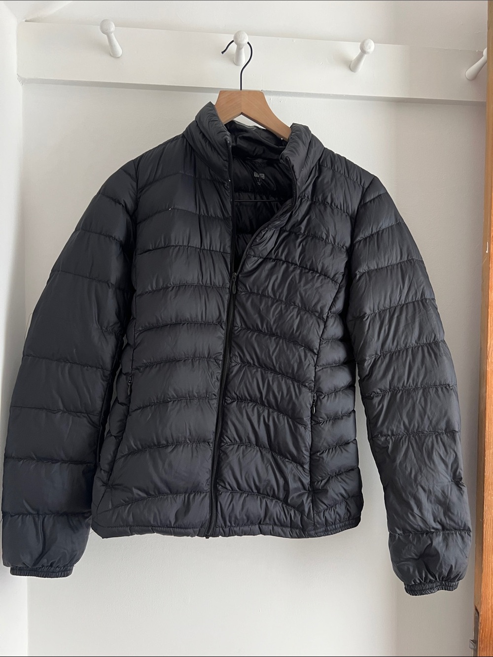 Uniqlo black down puffer small (one arm has stitching that has come undone